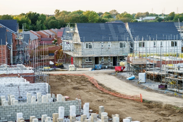 New housing development construction site showcasing homes built with sustainable practices and nuRe® nutrient neutrality solutions.